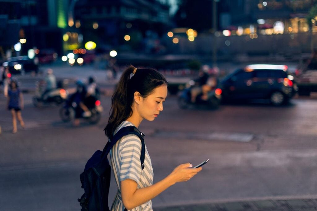 Traveler navigating city easily using china hong kong esim vs pocket wifi winning solution
