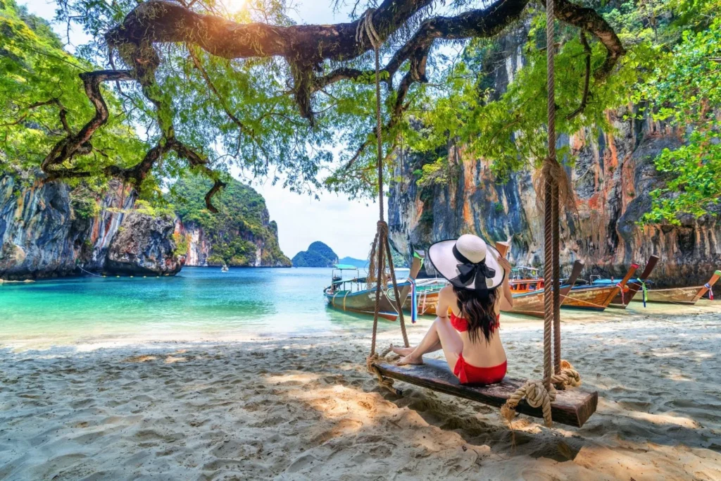 Thailand beach with tourists enjoying a safe and affordable travel destination