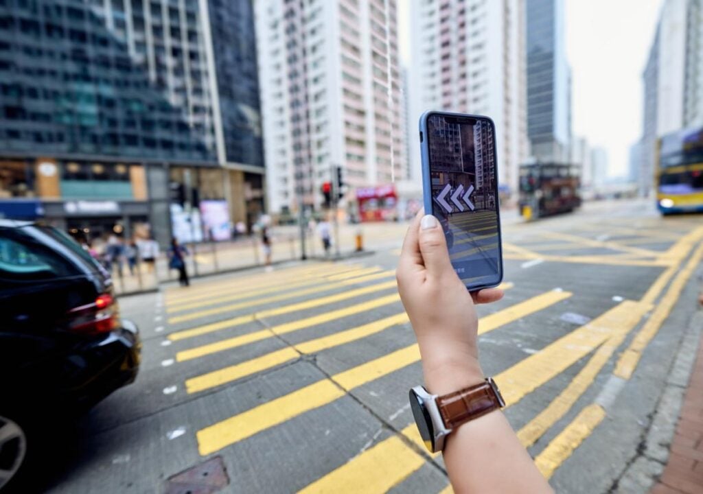 Traveler using maps with china hong kong travel esim for real time navigation in city