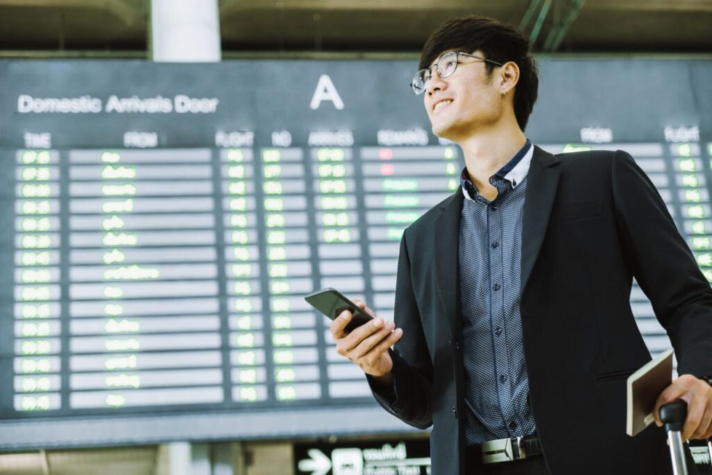 Executive arriving and using phone immediately with business travel china hong kong esim