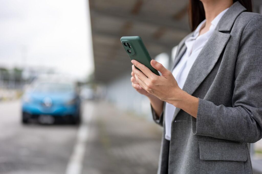 Business traveler booking ride using business travel china hong kong esim for fast airport transfer